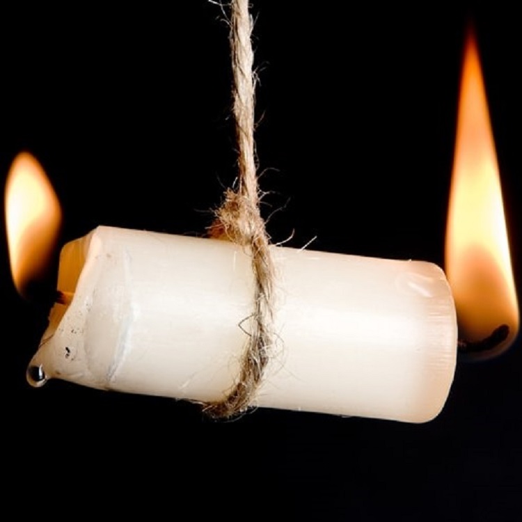 Image of a candle burning at both ends.