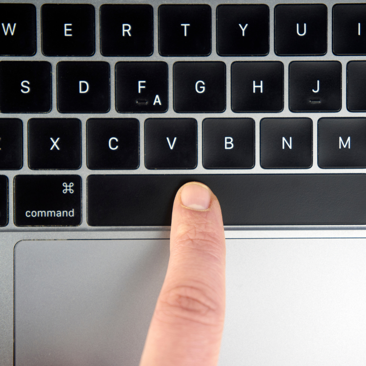 Image of a computer keyboard and a finger pressing the spacebar